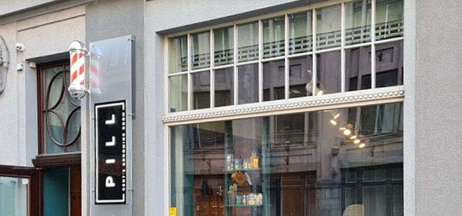 PILL Gent’s Grooming Room storefront on Vaļņu street in Rīga Old Town